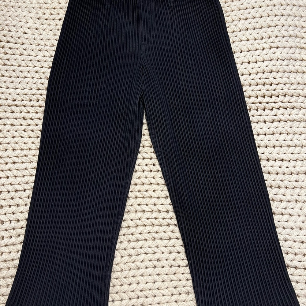These are a pair of homme plissé issey miyake pleated trousers.